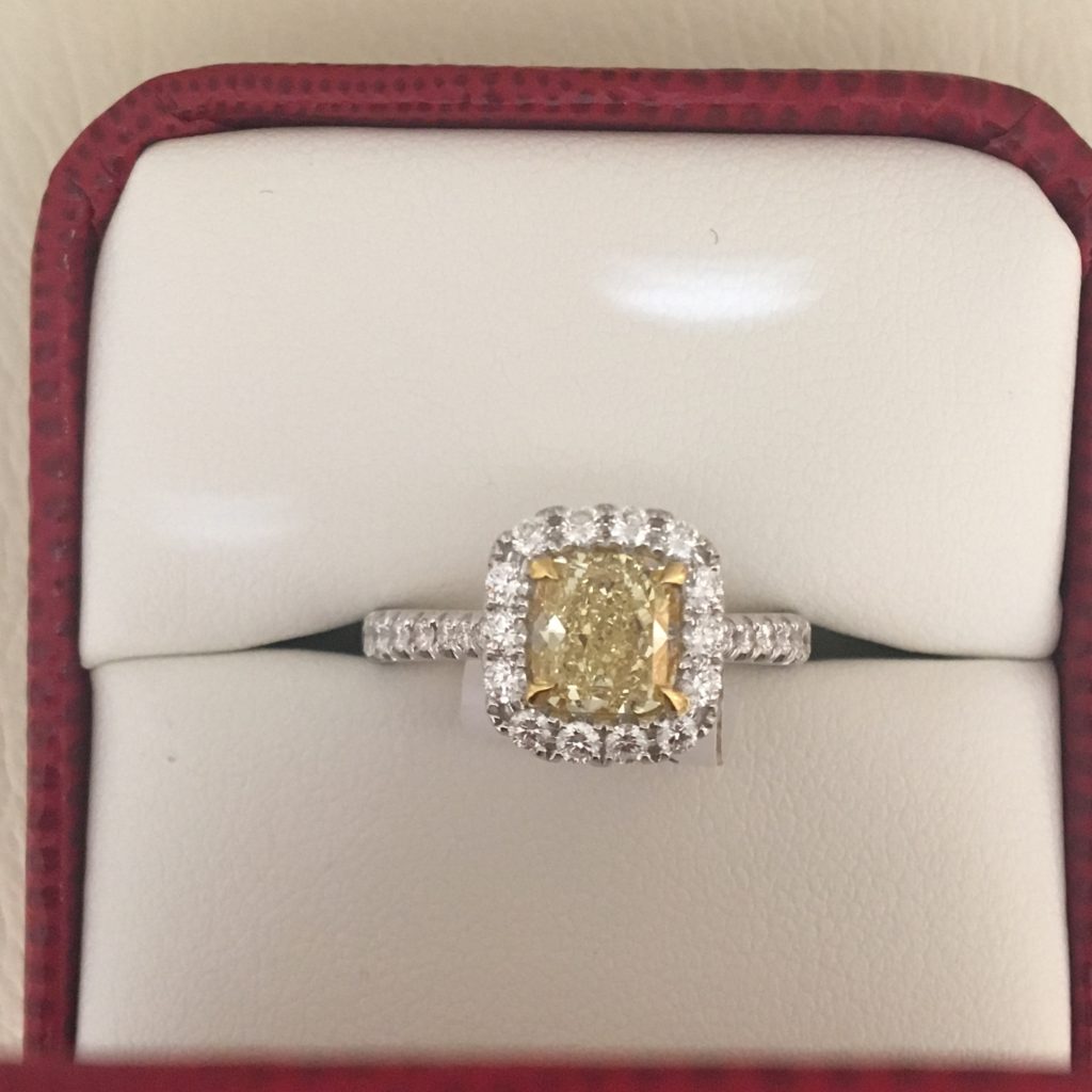 Yellow Diamonds - Schwanke-Kasten Jewelers Engagement Ring in 18k white gold with diamond halo